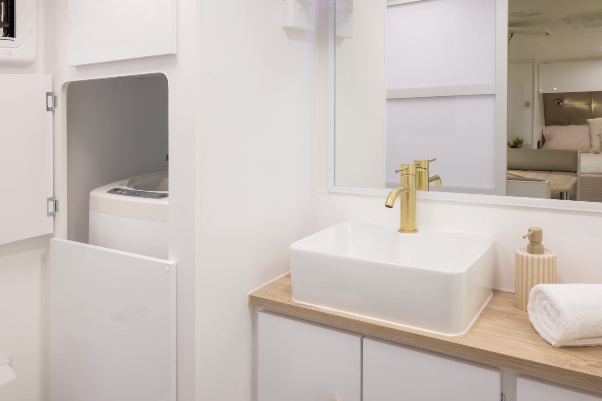 Supreme Classic Tourer ensuite bathroom interior — basin with concealed washing machine
