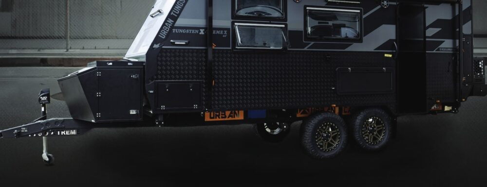 Urban Tungsten X-Treme X caravan studio render — side profile showing full length with checker-plate body and dual axle — Urban brochure 2026